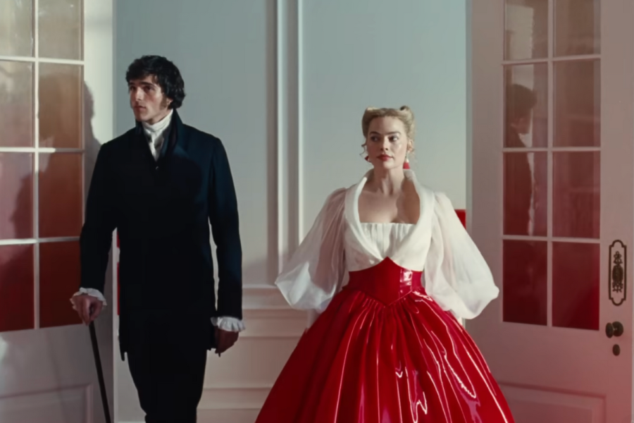 Margot Robbie red latex-style skirt, Jacob Elordi period-style coat