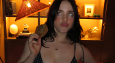 Billie Eilish holding a cookie