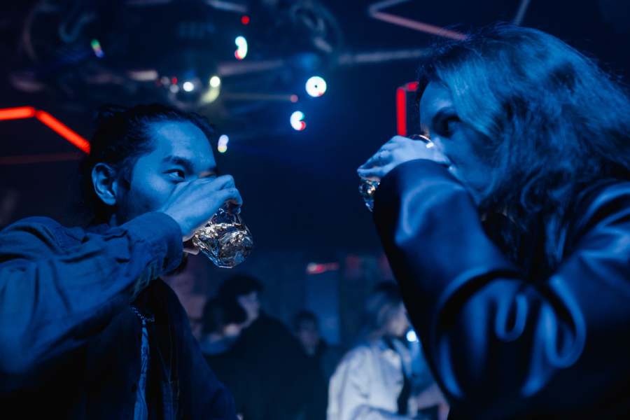 Boy and Girl Drinking in a Bar