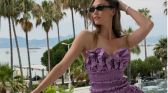 Karlie Kloss wearing a purple dress in Cannes