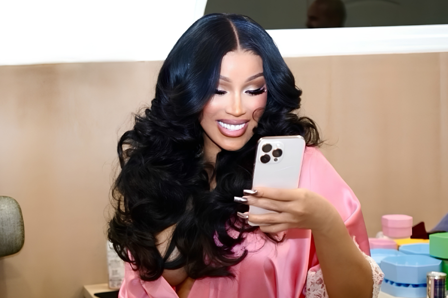 Cardi B holding an Iphone