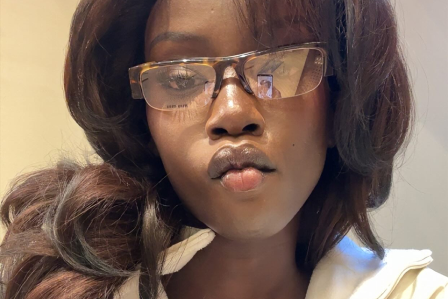 Anok Yai in eyeglasses pouting for a selfie