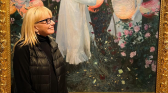 Ellen Mirojnick standing after the Painting