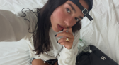 Dua Lipa's Work Uniform with Chanel Maxi Flap Bag