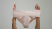 Person Holding a White Underwear