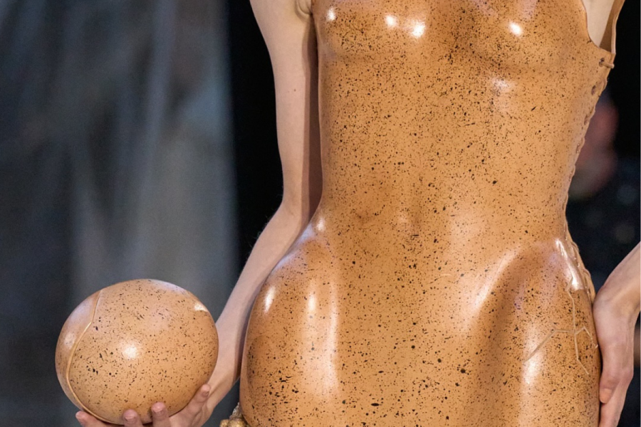 Lady wearing a cracked egg inspired couture