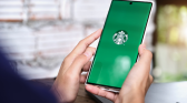 Woman Hand Holding Smart Phone Mobile Opening Starbuck App