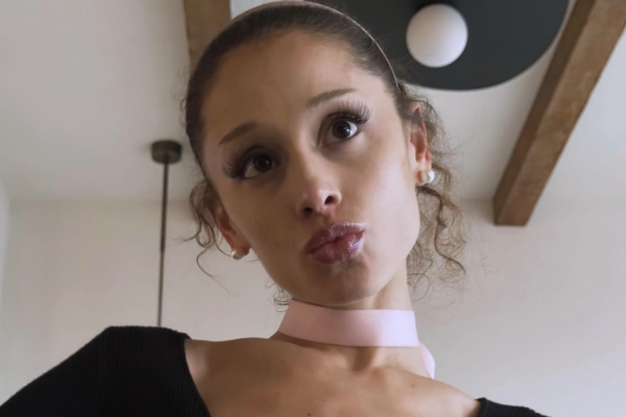 Ariana Grande pouting for a photo with curls