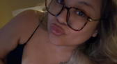 Ash Trevino with eyeglasses pouting for a photo