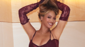 Beyonce holding her hair up while posing for a photo