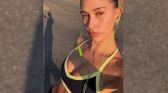 Hailey Bieber wearing SKLYLRK earphones
