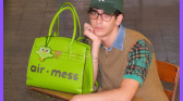 Duolingo model with Hermes Green Bag