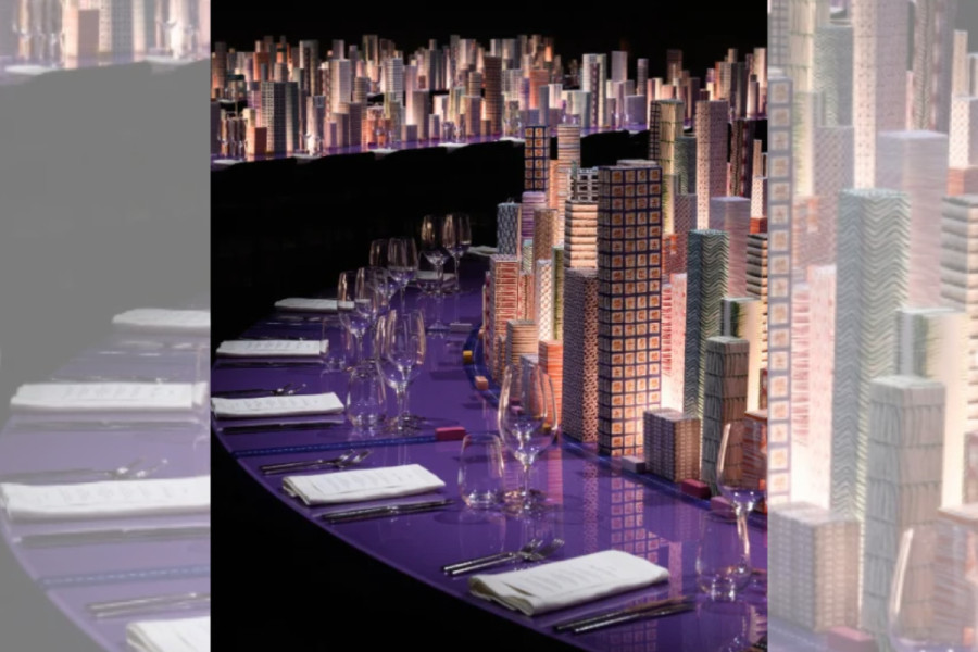 Illuminated miniature New York skyline on Hermès dinner table