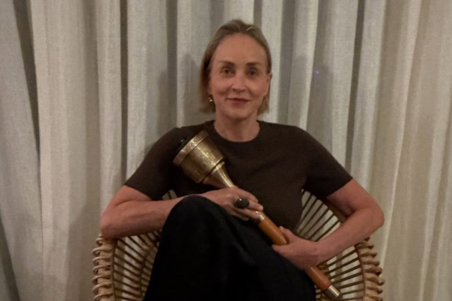 Sharon Stone Sitting in Gallery