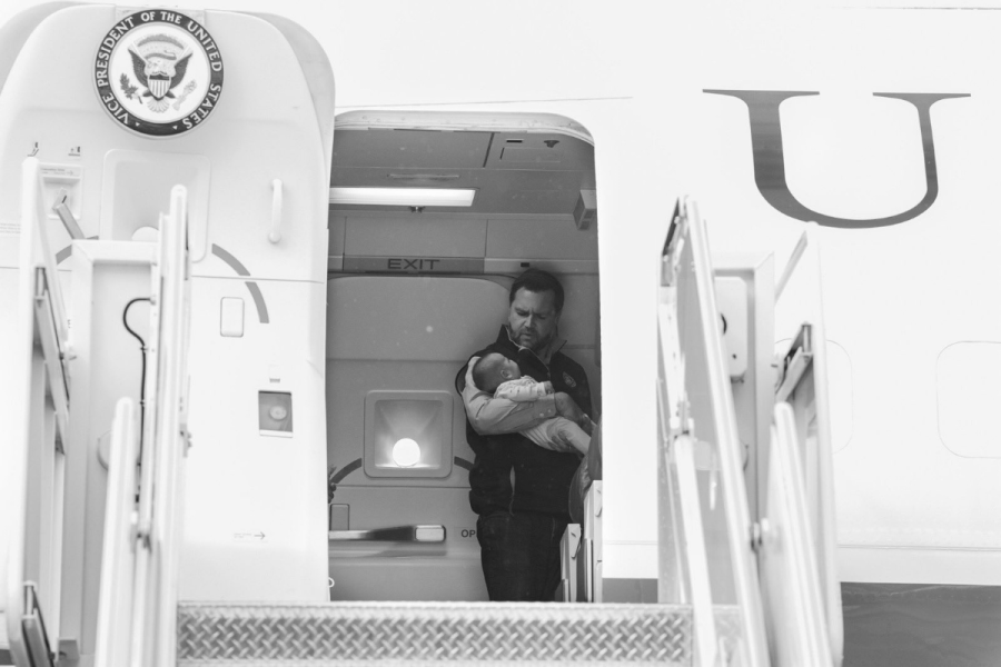 JD Vance holding his child on the plane