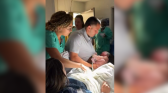 Newborn Grabs Dad in Viral Delivery-Room Moment