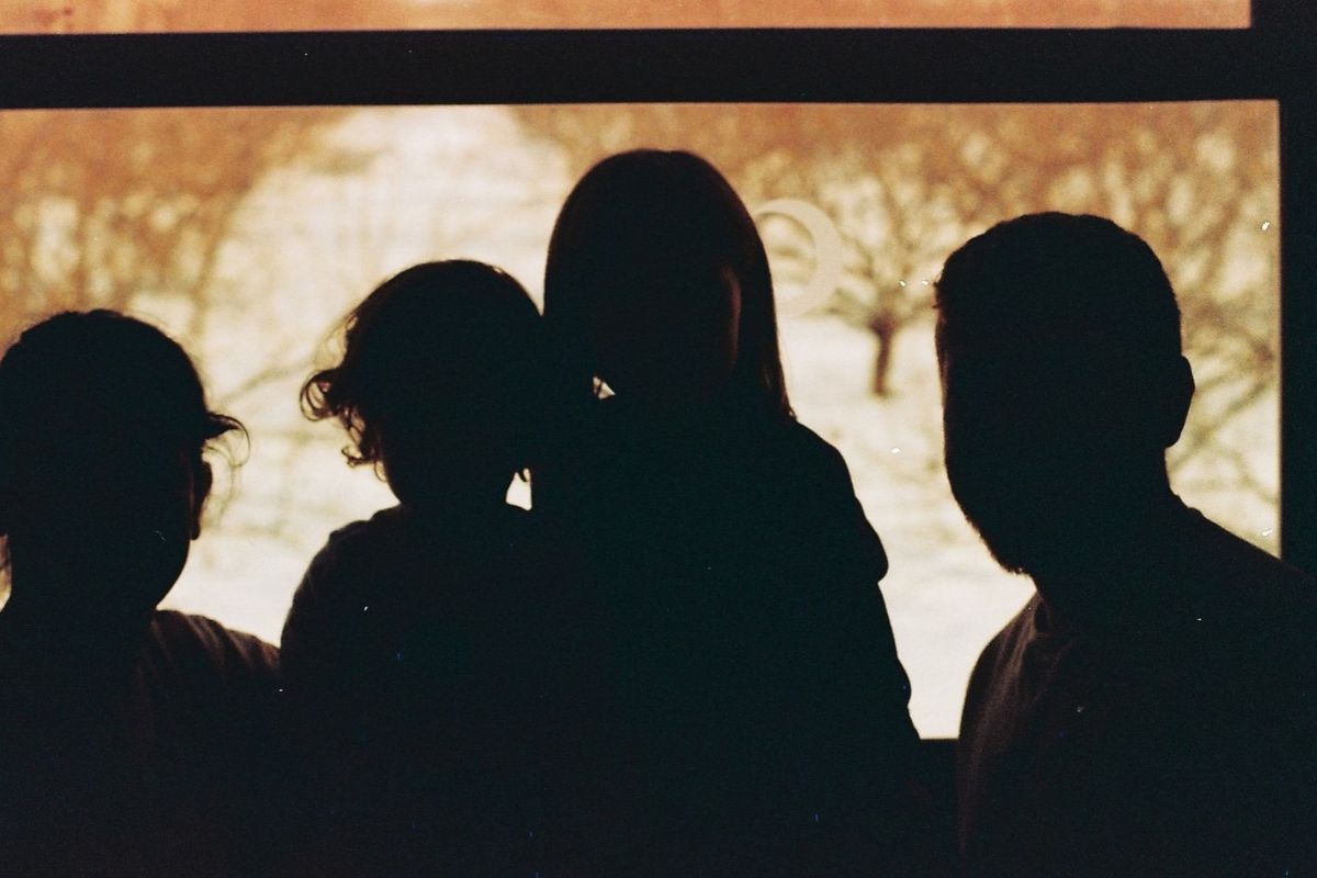 Children ominously covered by shadows