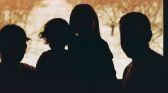 Children ominously covered by shadows