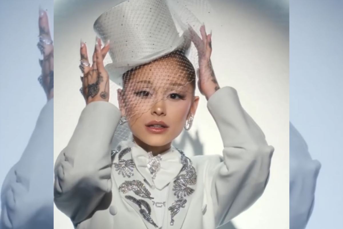 Ariana Grande Rocks a Tuxedo and Top Hat in the New Swarovski Holiday Commercial